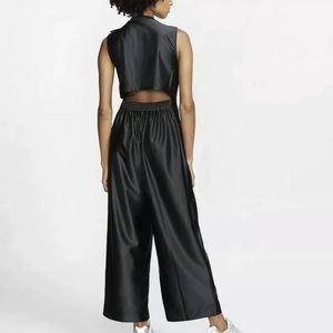 Nike jumpsuit black gold monogram logo elegant NWT